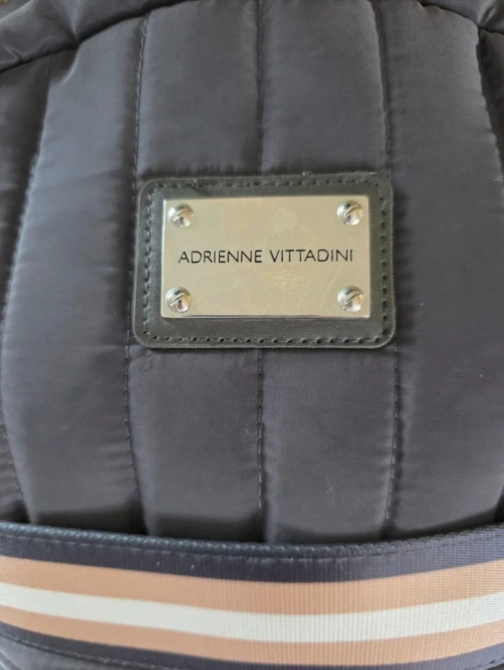 Quilted, Sleek, boxy, Gray Nylon Backpack with Pink-Tan Stripe.